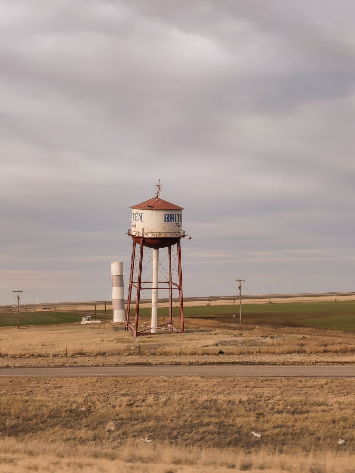 Leaning water tower on the open Texas Panhandle plains under a big sky